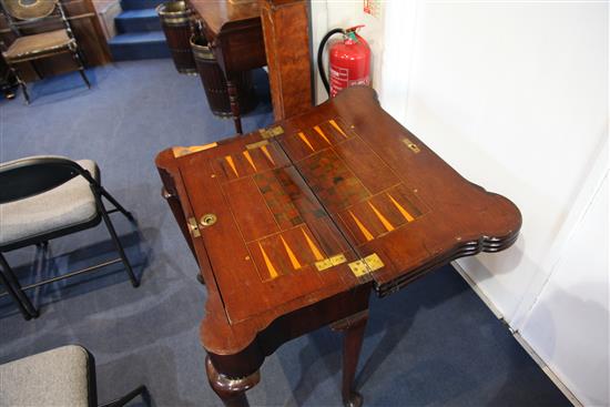 A George II mahogany combined tea, card and games table, H.2ft 6in. W.2ft 7in. D.1ft 4in.